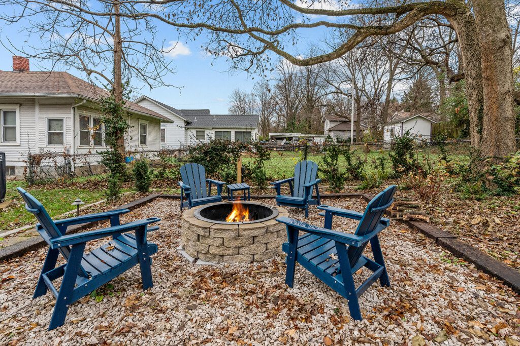 cairo st bungalow backyard fire pit adirondack chairs