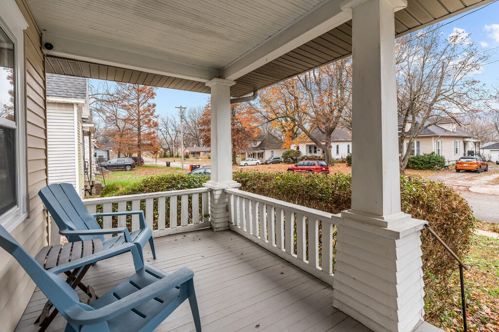 cairo st bungalow front porch adirondack chairs