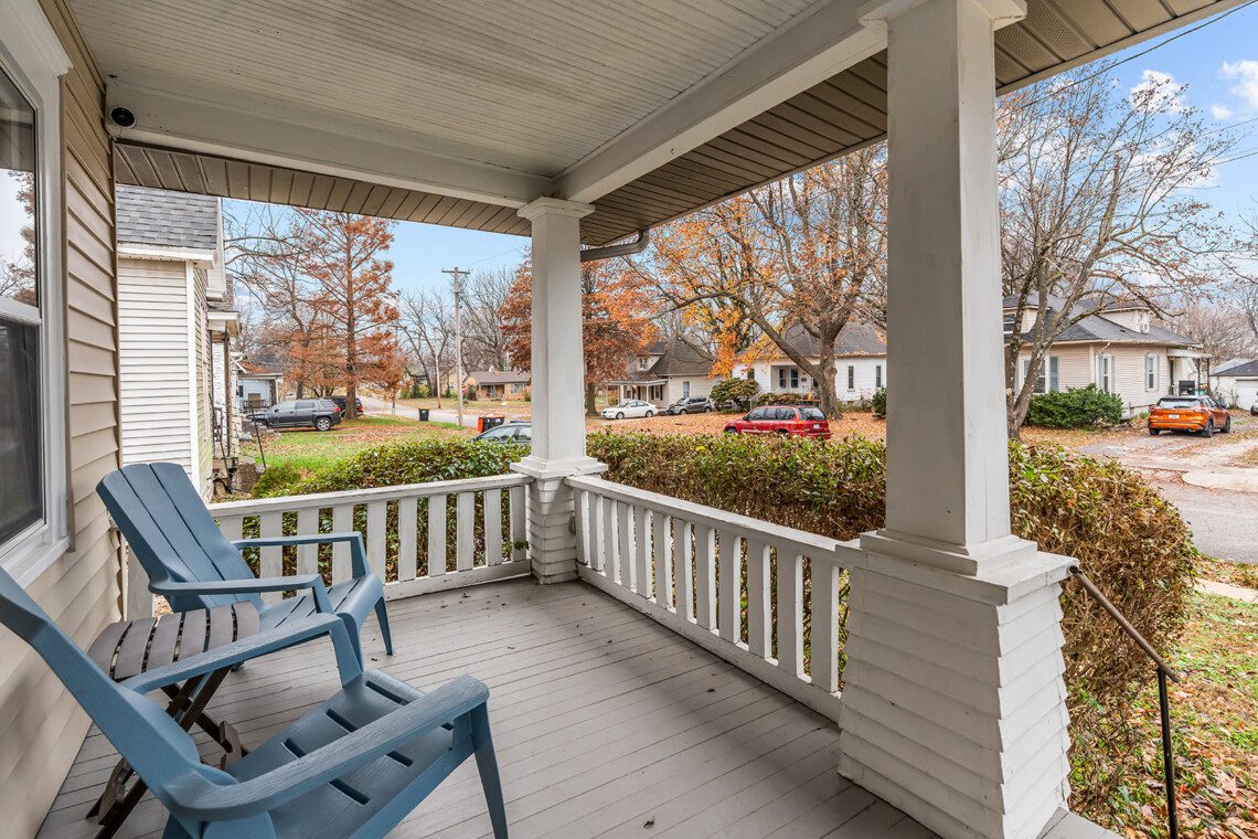 cairo st bungalow front porch adirondack chairs