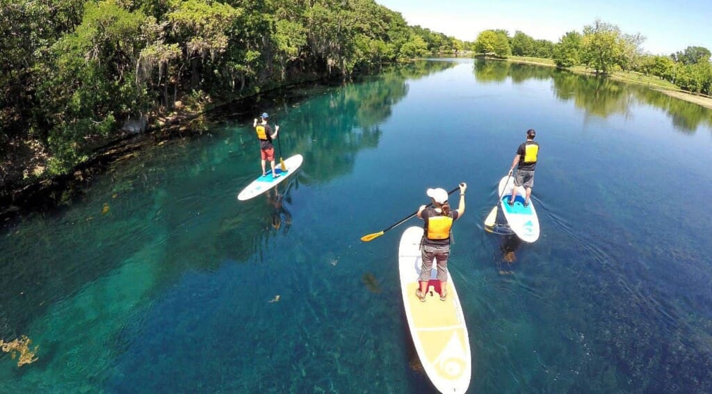 Stand up paddleboarding on a lake near Springfield MO